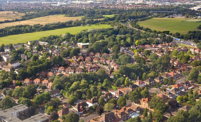 An aerial view of houses and trees